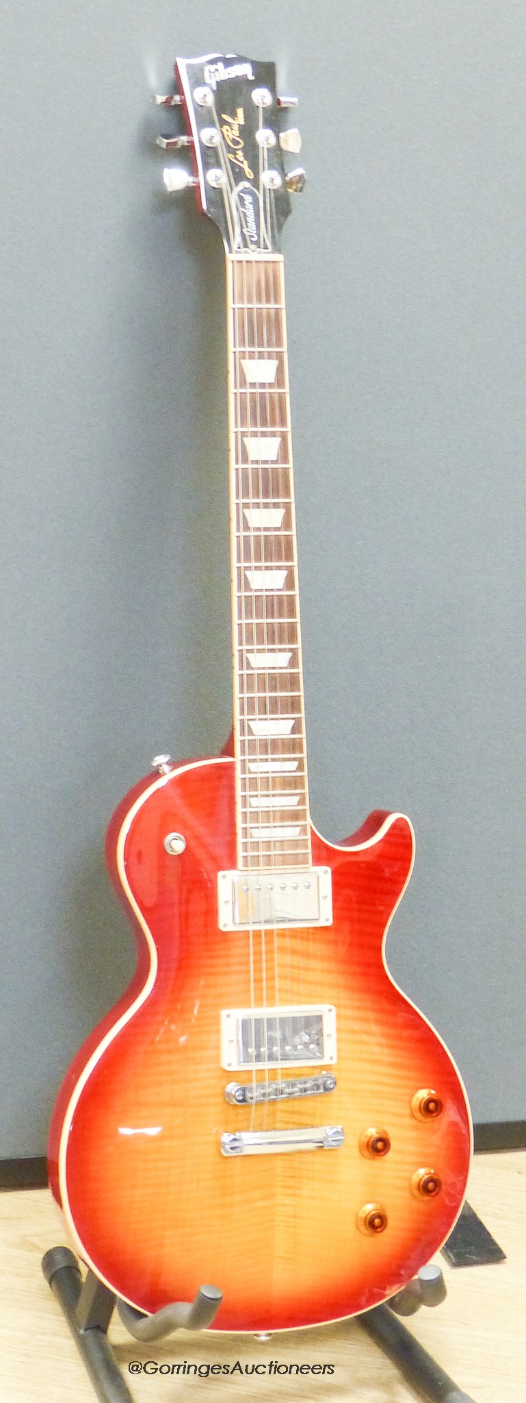 A Gibson Les Paul Standard High Performance electric guitar, serial number 130007345, c.2018, cherry sunburst with Gibson hard case and stand
